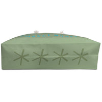 Bottom of bag with 4 large asterisk graphics in teal blue.