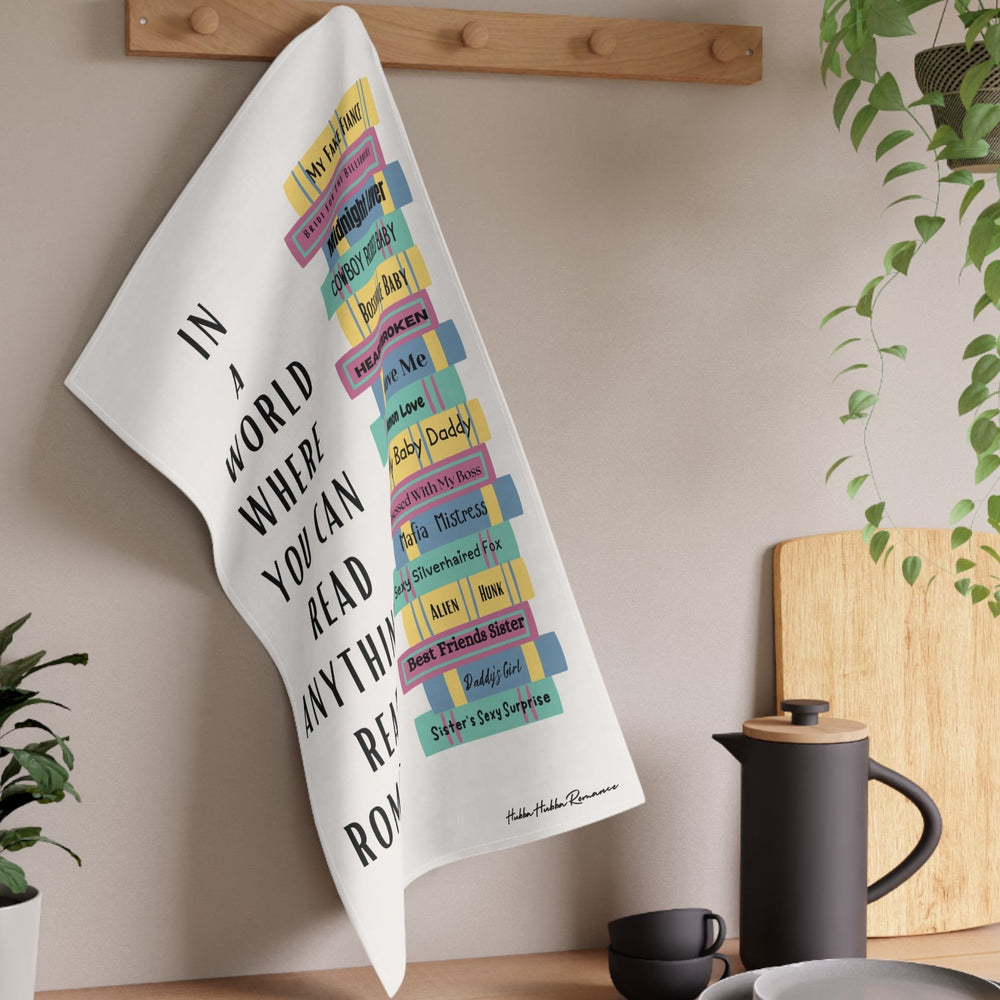 The towel is displayed on a wall hook in a kitchen setting.
