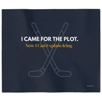 A navy blue sweatshirt blanket features white text that reads 'I CAME FOR THE PLOT. Underneath it gold text reads "Now I can explain icing."