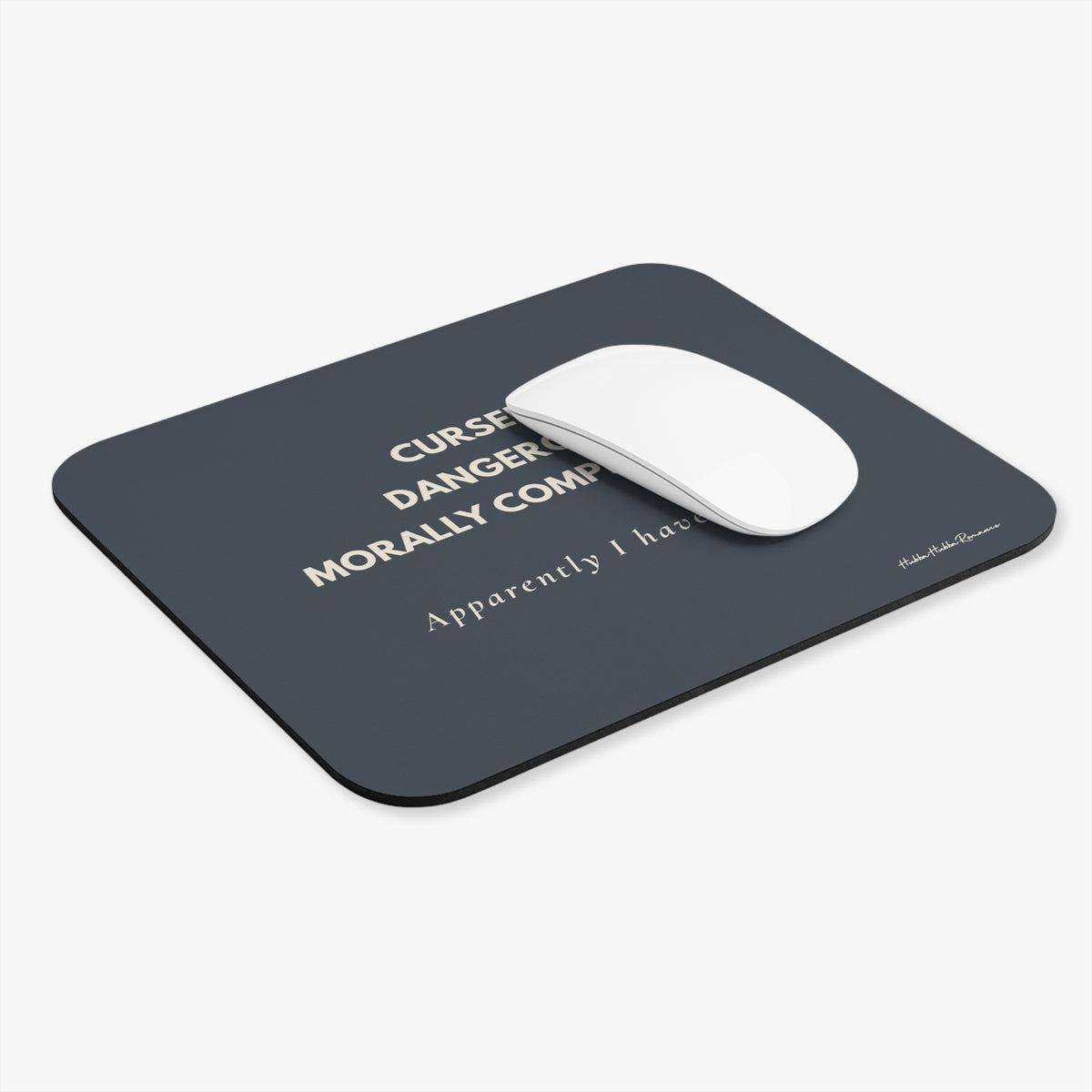 Black mouse pad with cream text and a white mouse on a white background