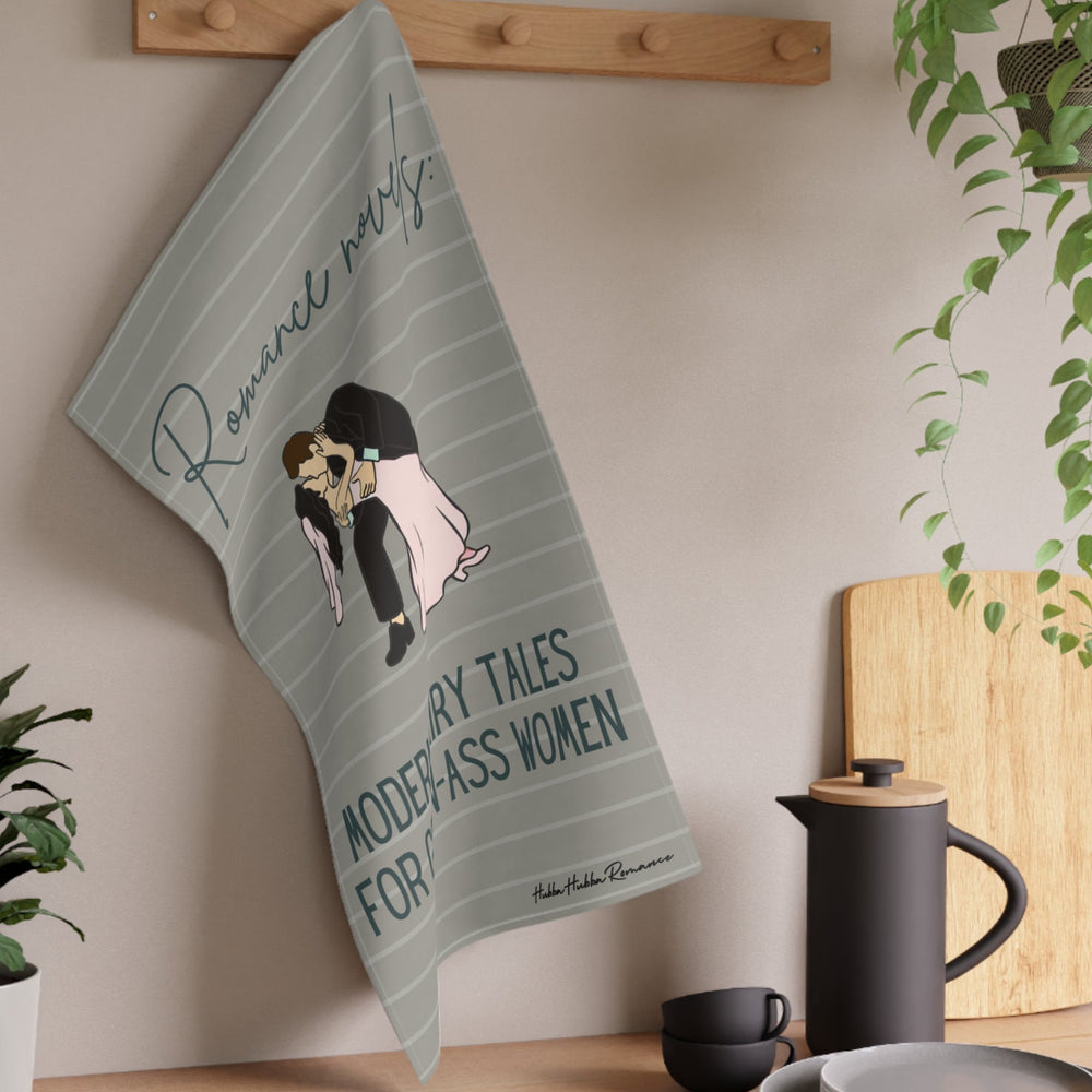 The towel is displayed on a wall hook in a kitchen setting.