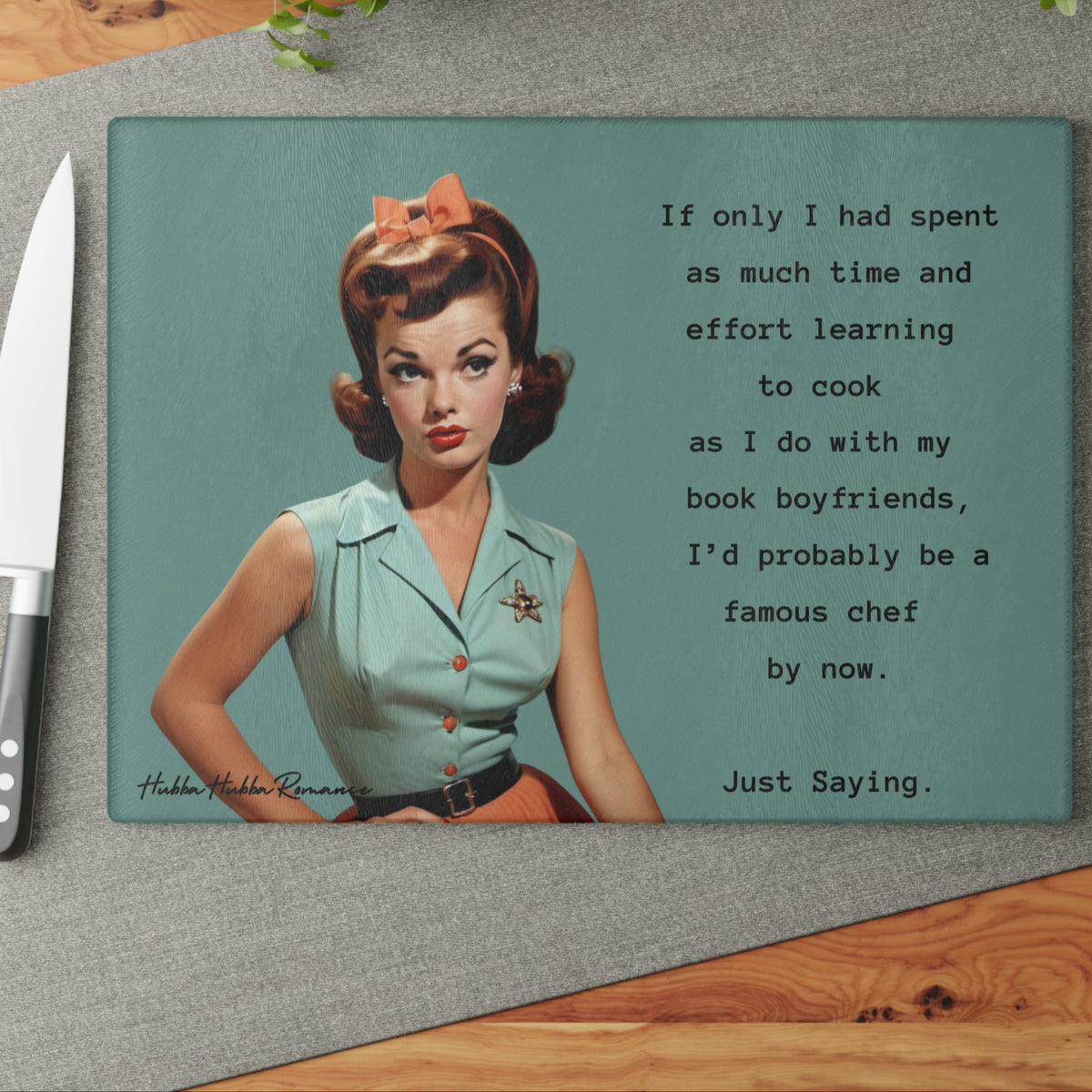 This image shows the cutting board displayed on the table with a knife placed beside it in anticipation of using the board to cut something.



