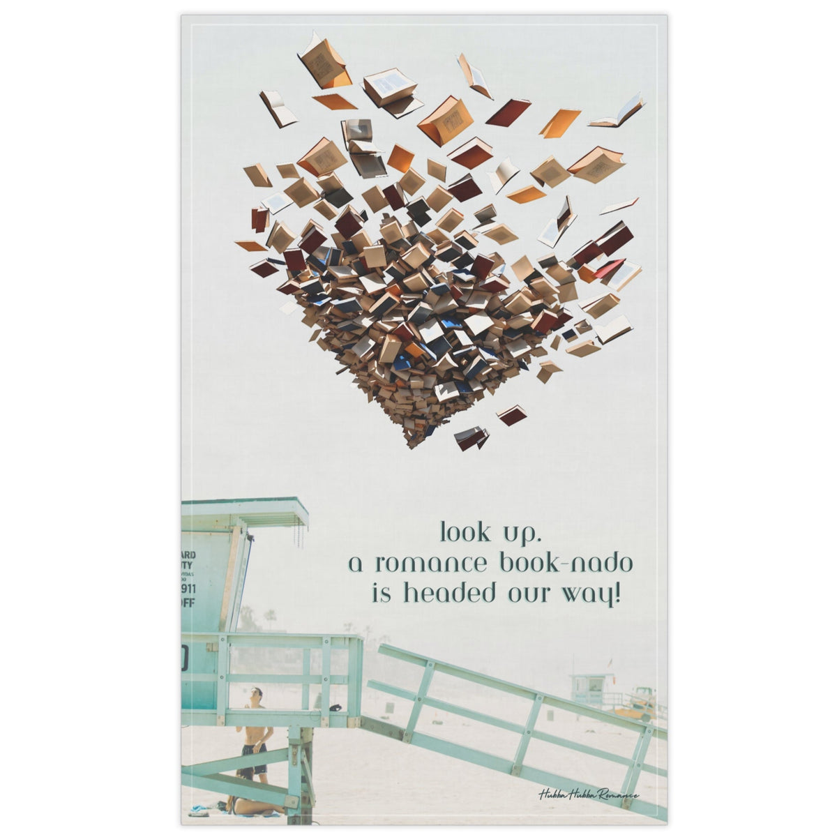 An oversized kitchen towel featuring a beach scene with a green lifeguard tower and a man looking up, along with tourists on the beach. In the sky, there is a swirling tornado of books. The text reads: Look Up. A Romance Book-Nado Is Headed Our Way. It is a tongue-in-cheek reference to all the beach books read by sun worshippers.