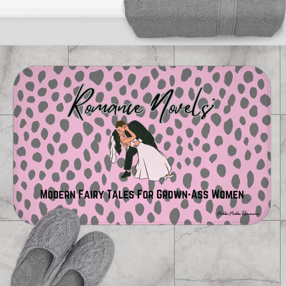 The bath mat is displayed next to a tub with a pair of slippers for size context.

