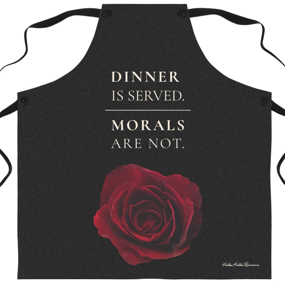 A black apron with a red rose graphic and the large cream colored text above it that reads 'DINNER IS SERVED. MORALS ARE NOT.
