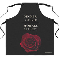 A black apron with a red rose graphic and the large cream colored text above it that reads 'DINNER IS SERVED. MORALS ARE NOT.