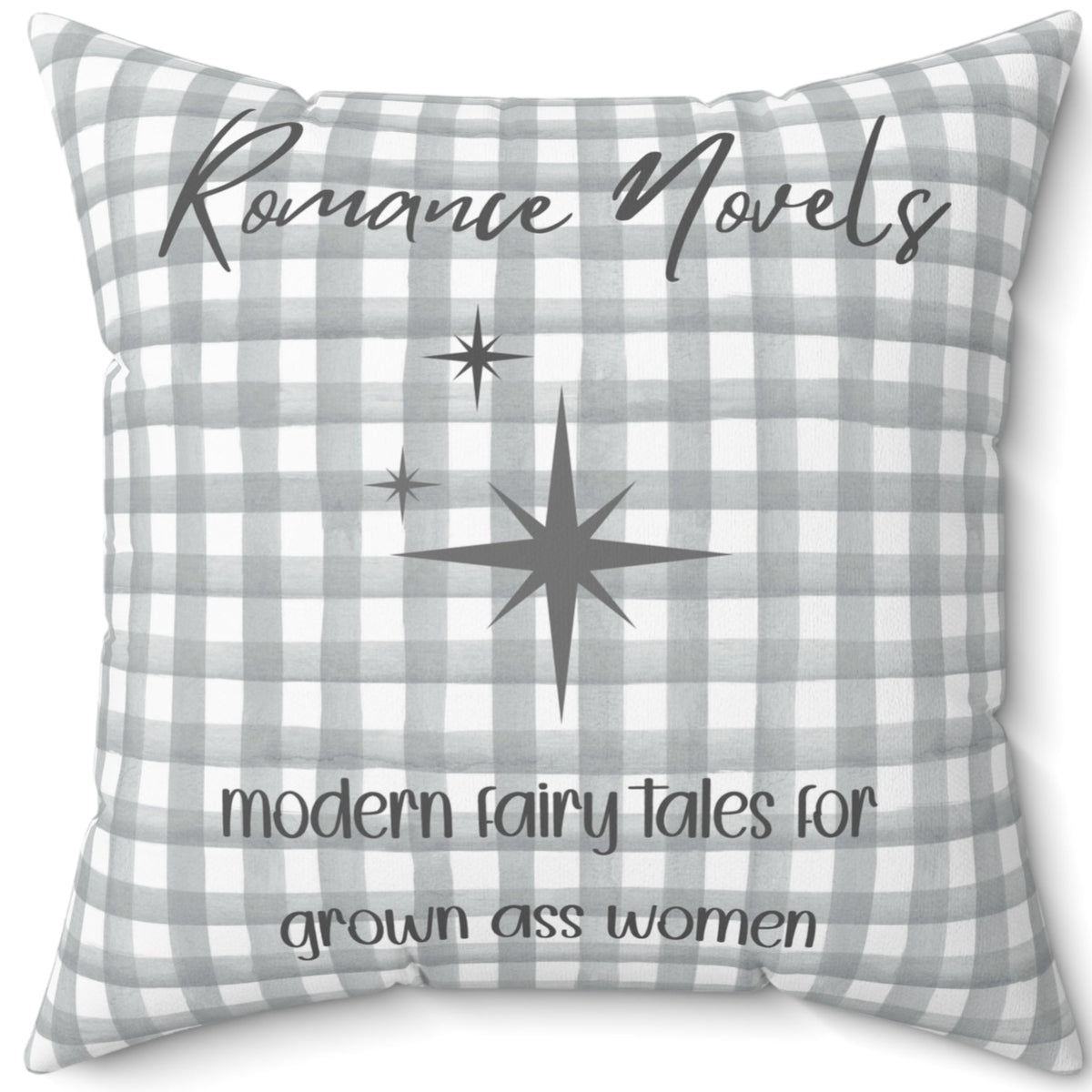 A 20-inch pillow featuring a gray and white gingham background with elegant script text that reads: "Romance Novels." Below, in a playful handwritten-style font, the phrase "modern fairy tales for grown ass women" is written. To the left of the text, there are three gray starbursts, adding a touch of vintage charm. The overall design is minimalist yet bold, appealing to romance readers who embrace their love for modern-day fairy tales.