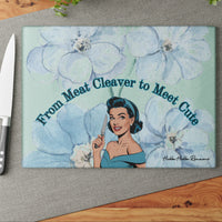 This image shows the cutting board displayed on the table with a knife placed beside it in anticipation of using the board to cut something.

