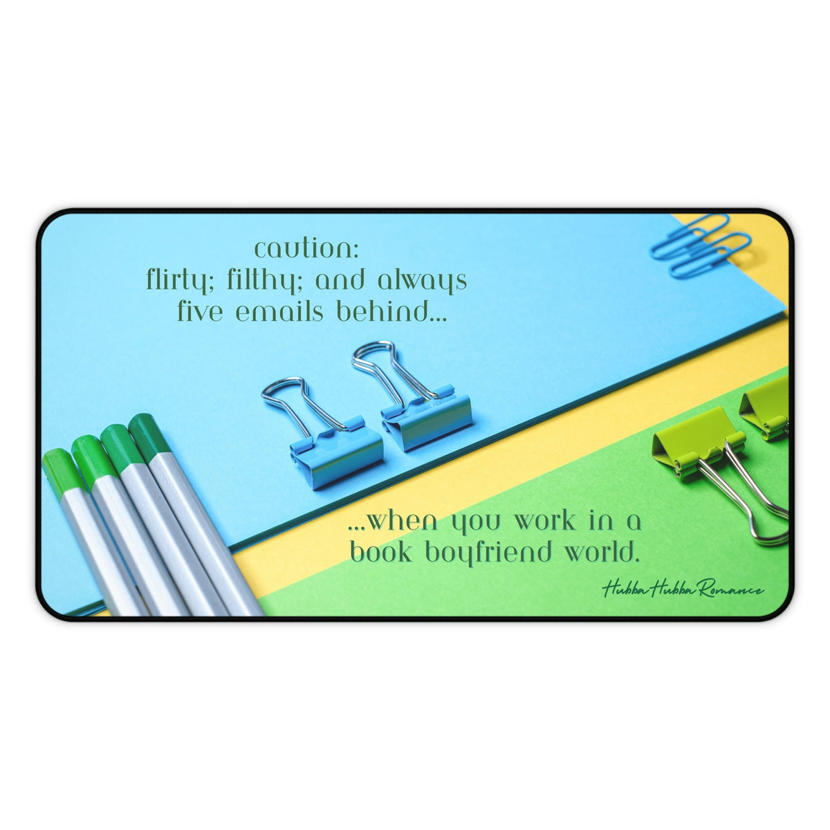 A colorful flat-lay image of bright blue, green, and yellow office supplies—binder clips, pens, and folders. The top text reads, “Caution: flirty, filthy, and always five emails behind.” Bottom text says, “working girl life in a book boyfriend world.” This is the medium version.