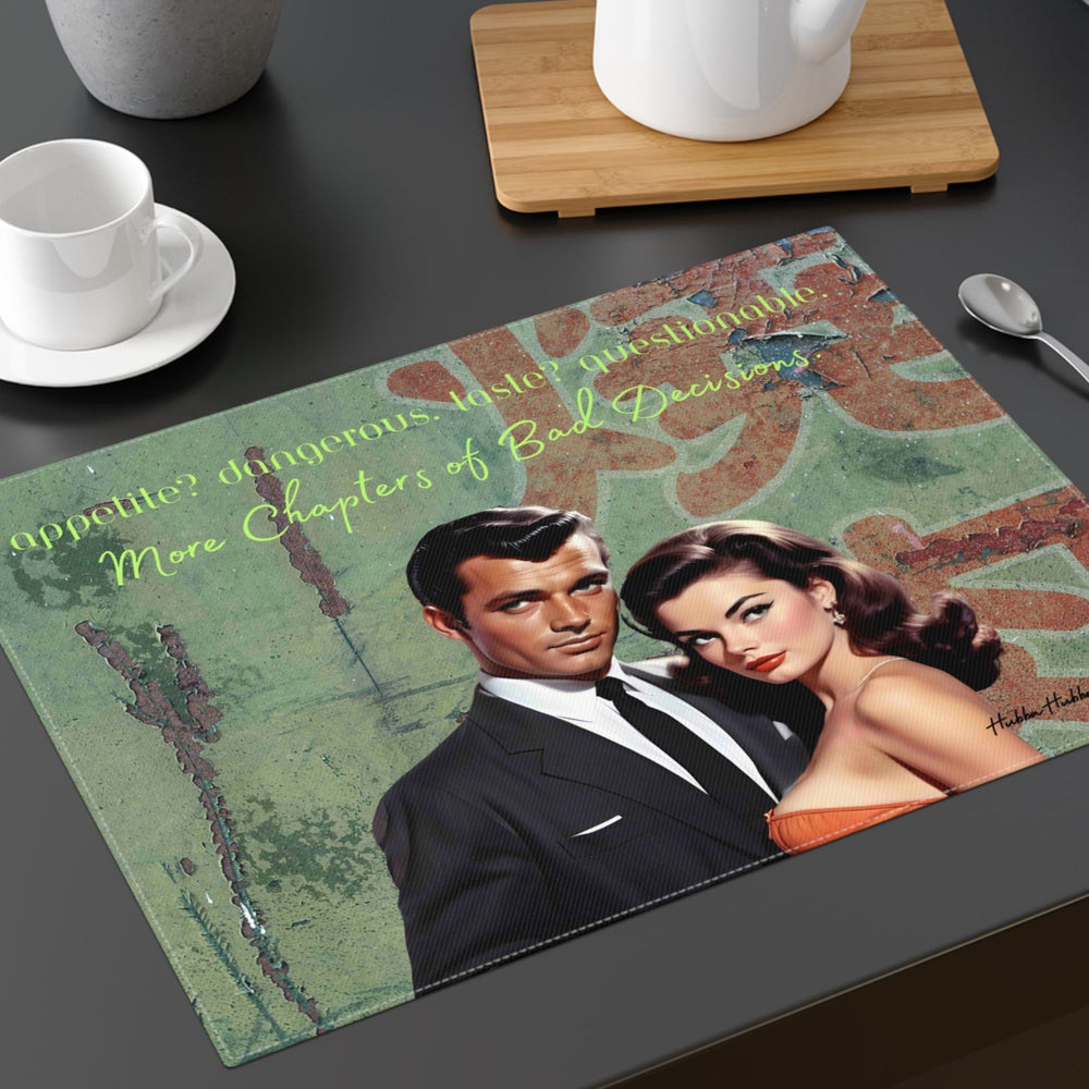 The placemat is displayed on a table with a cup and saucer, a teapot, a plant, and a spoon for context.

