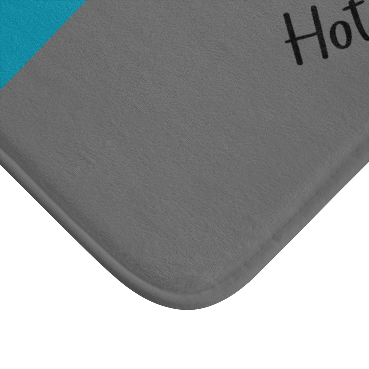 The corner of the mat is displayed to show the finished edges.