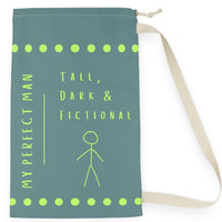 This laundry bag features a minimalist design on a muted greenish-gray background. A lime green stick figure stands next to bold lime green text that reads “Tall, Dark & Fictional,” with the words “My Perfect Man” printed vertically along the side. Rows of lime-green dots border the top and bottom of the bag. The bag includes a durable canvas carrying strap and a drawstring enclosure for secure, easy transport. This is the small version. 