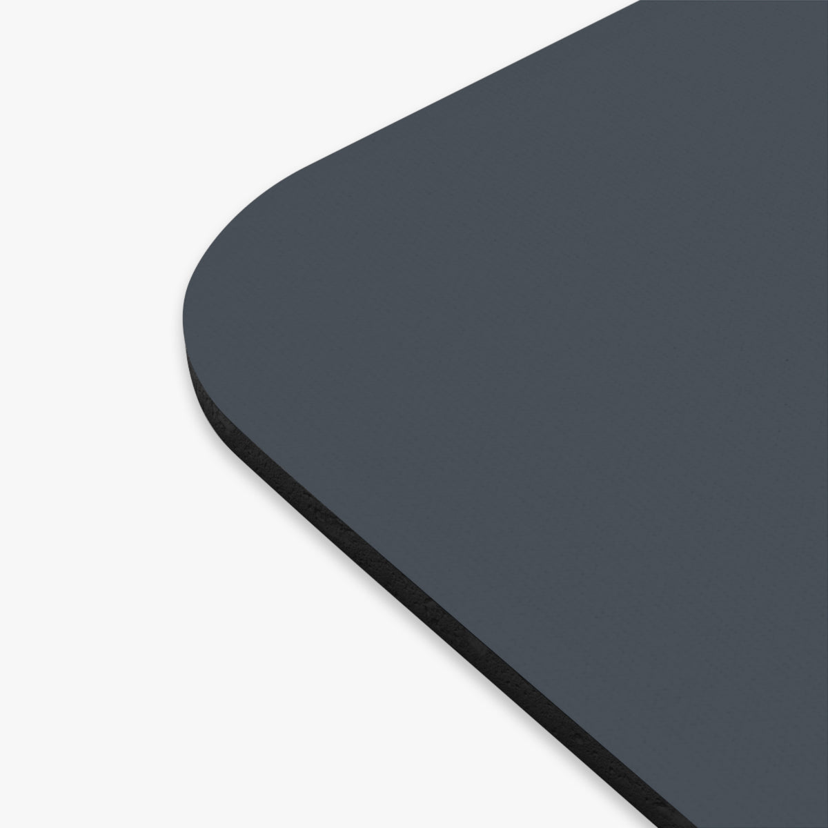 close up of  darl gray mouse pad corner,
