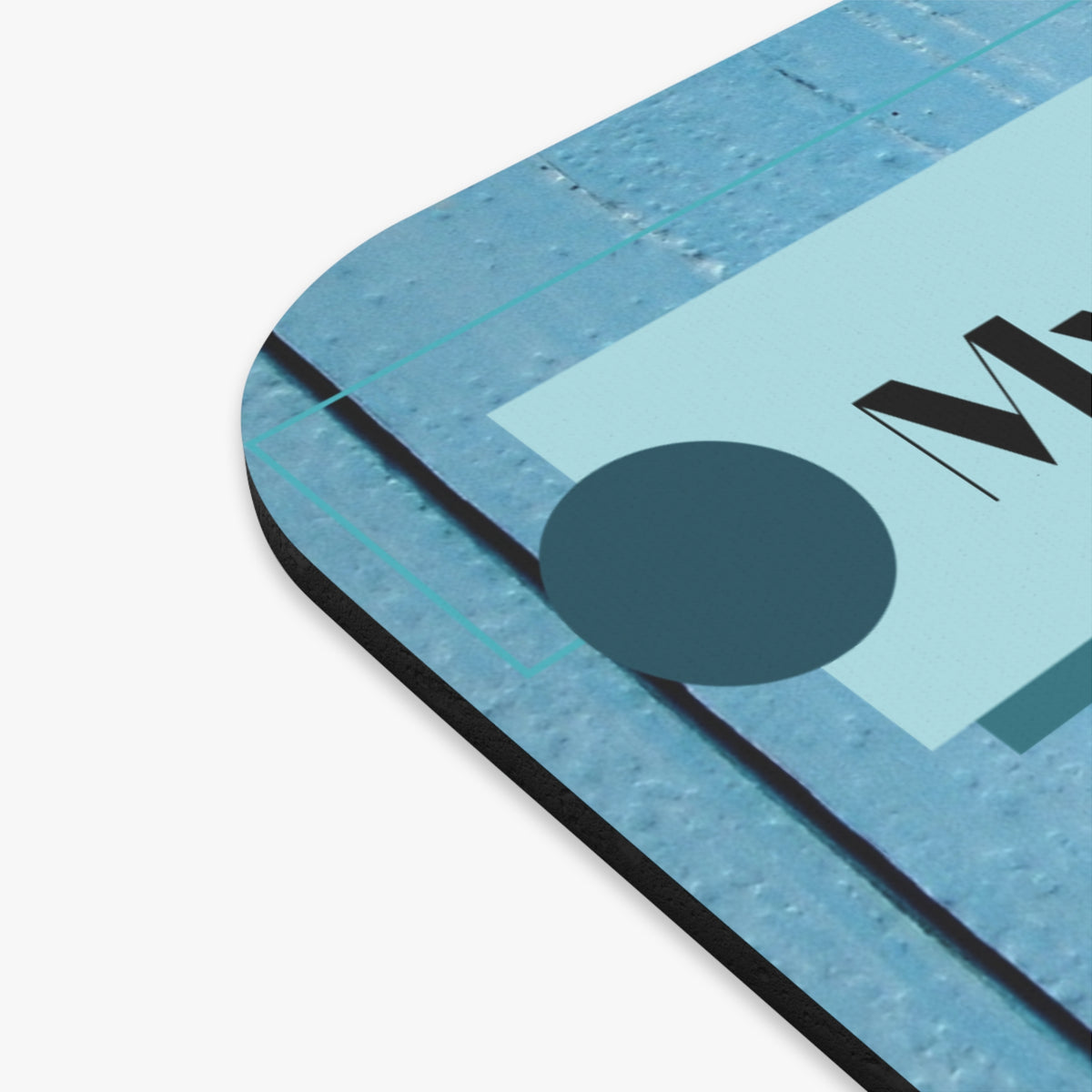 Picture showing close-up edge of mouse pad.