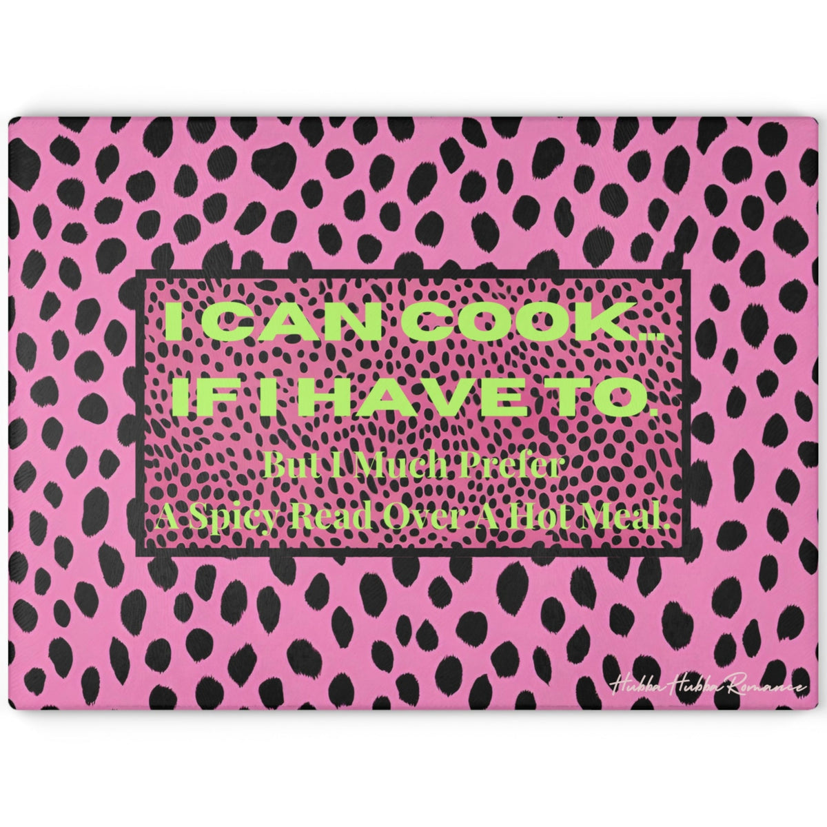 Glass cutting board featuring a hot pink and black leopard print background. Centered on the board is a bold text box that reads: “I CAN COOK—IF I HAVE TO. But I Much Prefer A Spicy Read Over A Hot Meal.” Made from durable, textured tempered glass with non-slip rubber feet for stability. This is the larger size.