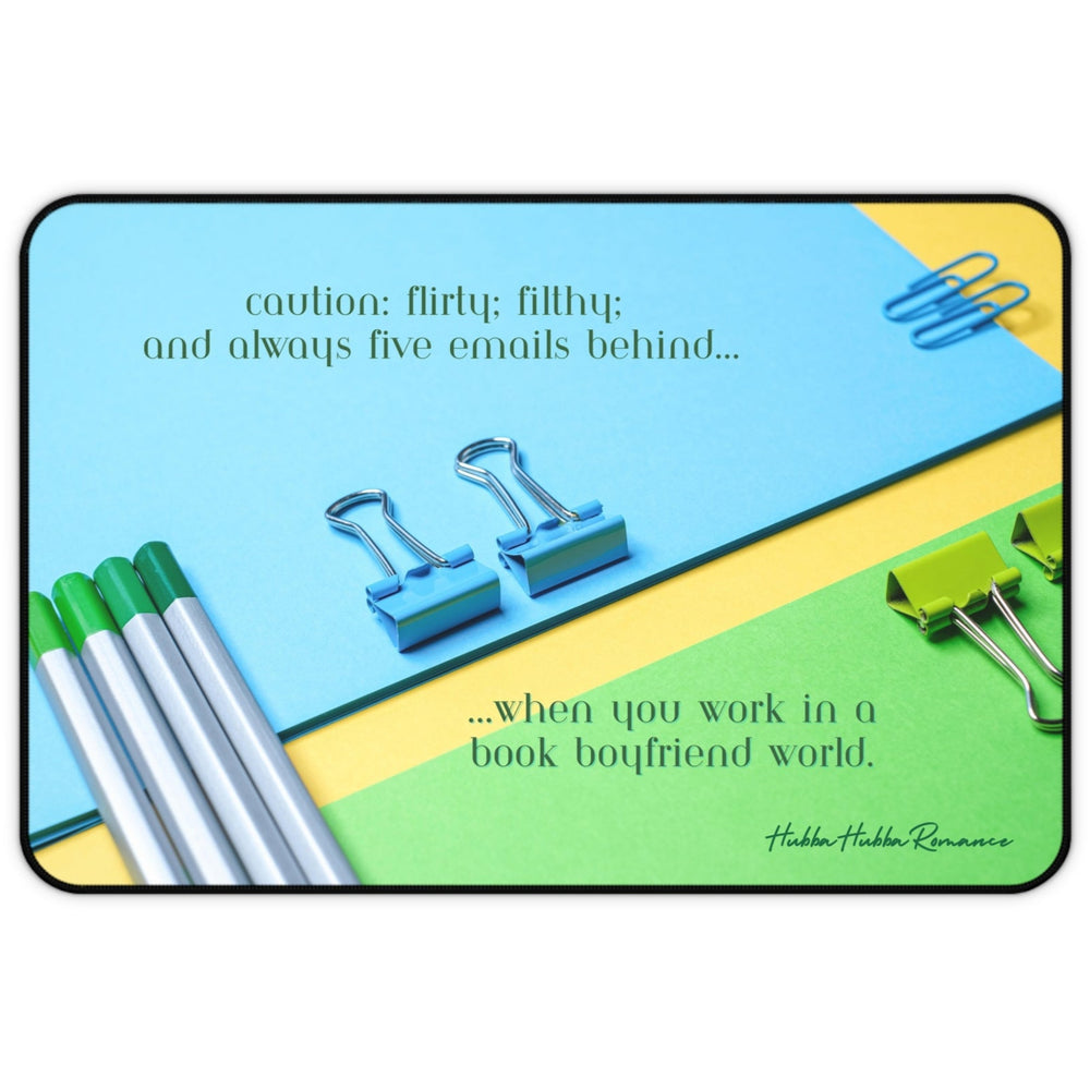 A colorful flat-lay image of bright blue, green, and yellow office supplies—binder clips, pens, and folders. The top text reads, “Caution: flirty, filthy, and always five emails behind.” Bottom text says, “working girl life in a book boyfriend world.” This is the small version.