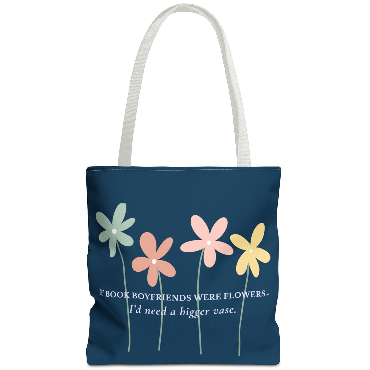 A navy blue tote bag with white shoulder straps, featuring a graphic of four colorful flowers (green, orange, pink, yellow) and the quote 'BOOK BOYFRIENDS WERE FLOWERS. I'd need a bigger vase.