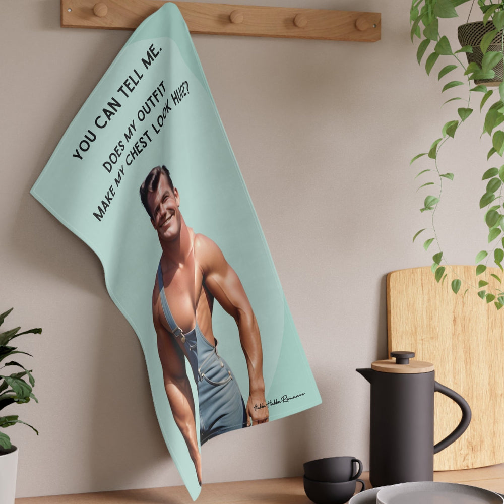 The towel is displayed on a wall hook in a kitchen setting.

