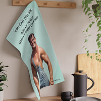 The towel is displayed on a wall hook in a kitchen setting.
