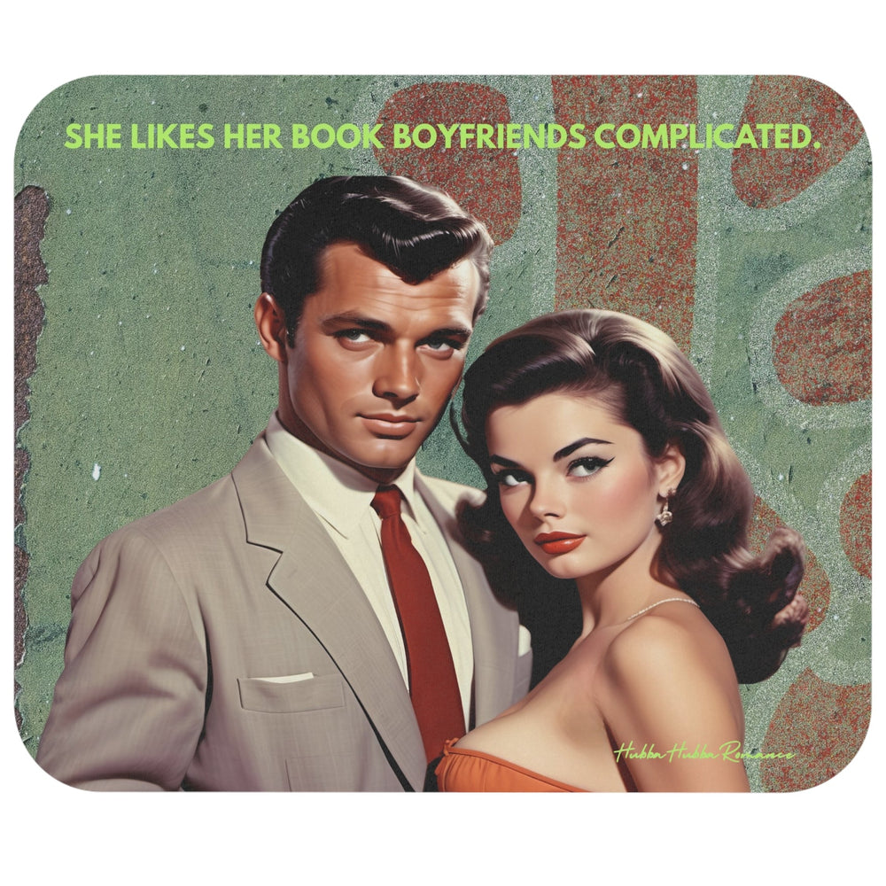 A rectangular mouse pad  with rounded corners featuring a vintage-style illustrated portrait of a man and woman, with the text 'SHE LIKES HER BOOK BOYFRIENDS COMPLICATED.' across the top.