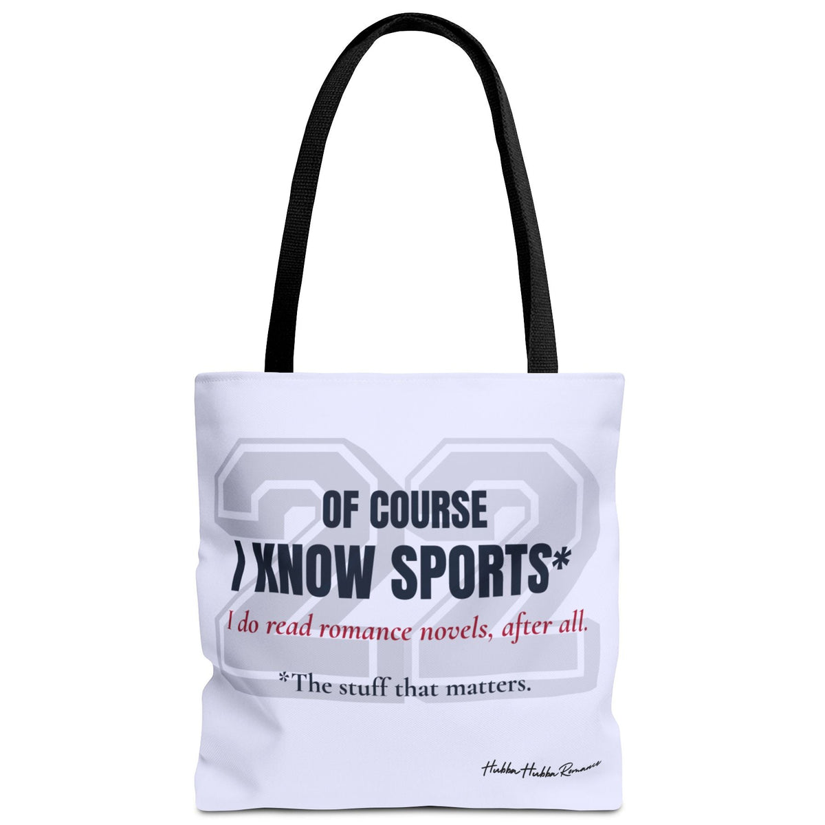 Pale blue romance reader tote bag with a large pale gray varsity-style 22 and dark navy text reading “Of Course I Know Sports*.” Red script reads “I do read romance novels, after all.” Small dark text reads “*The stuff that matters.” Black handles.