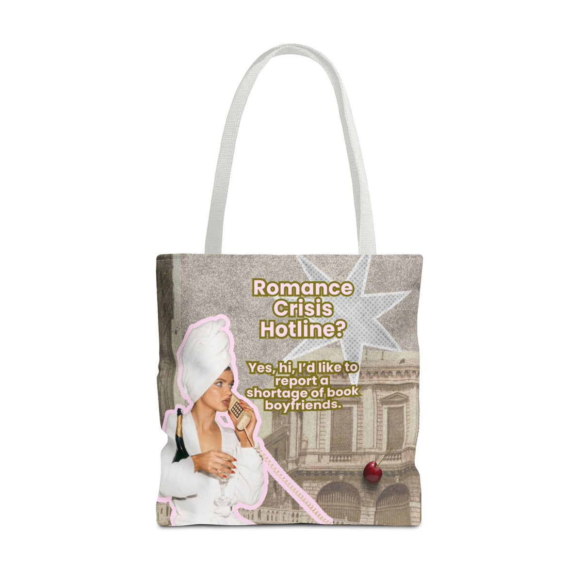 A tote bag with white shoulder straps, featuring a printed graphic collage with the text 'Romance Crisis Hotline?' and an illustration of a woman in a white robe and towel, holding a bottle of champaign and talking on a phone next to a classical building. Totally silly but fun.