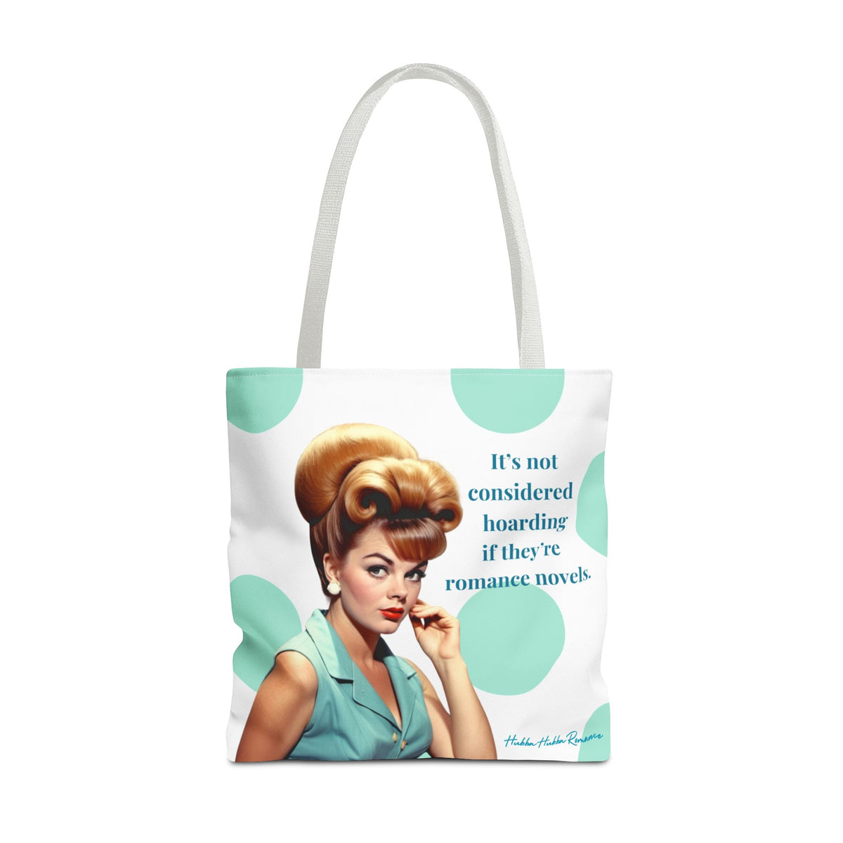 A white  tote bag with white shoulder straps, featuring a retro-style illustration of a woman with a large blonde bouffant hairstyle and a mint green polka dot background. The text on the bag reads, 'It's not considered hoarding if they're romance novels.