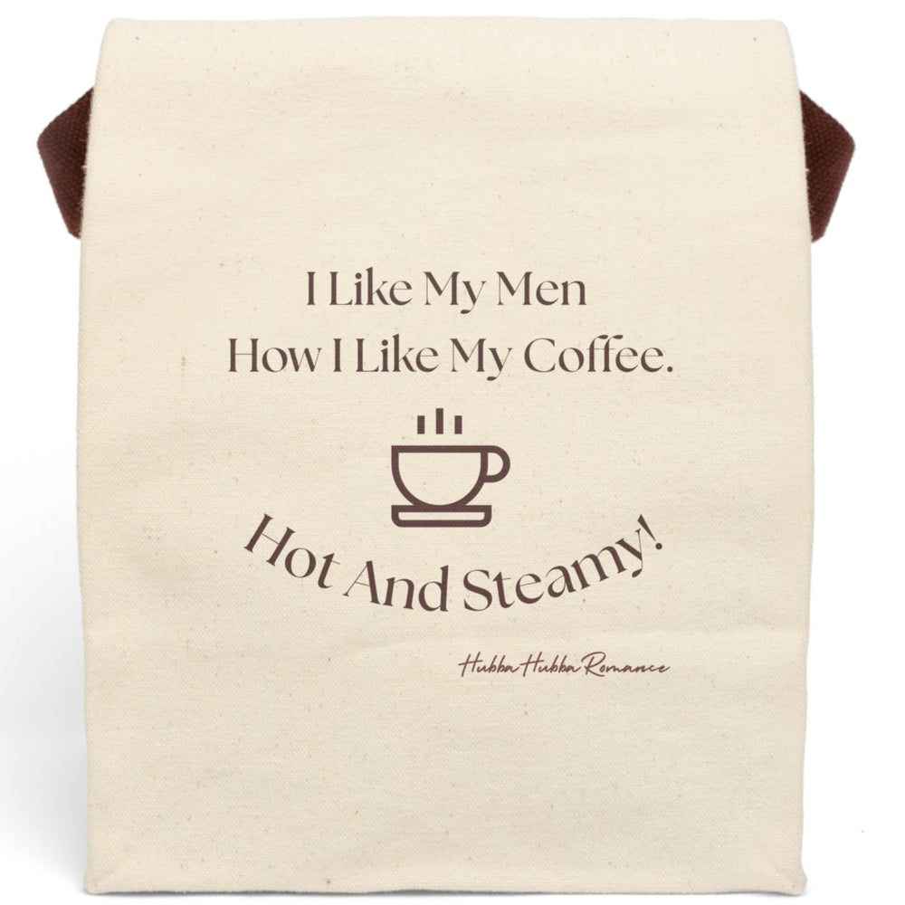 This canvas lunch bag features a plain canvas background with brown typography and a simple brown coffee cup icon. The top reads, “I Like My Men How I Like My Coffee.” Below the coffee cup, curved text finishes the joke: “Hot And Steamy!” The design is clean, cheeky, and perfect for coffee lovers and romance readers alike. The bag includes a durable canvas body, roll-top closure, and a carrying strap for easy transport.