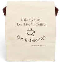 This canvas lunch bag features a plain canvas background with brown typography and a simple brown coffee cup icon. The top reads, “I Like My Men How I Like My Coffee.” Below the coffee cup, curved text finishes the joke: “Hot And Steamy!” The design is clean, cheeky, and perfect for coffee lovers and romance readers alike. The bag includes a durable canvas body, roll-top closure, and a carrying strap for easy transport.