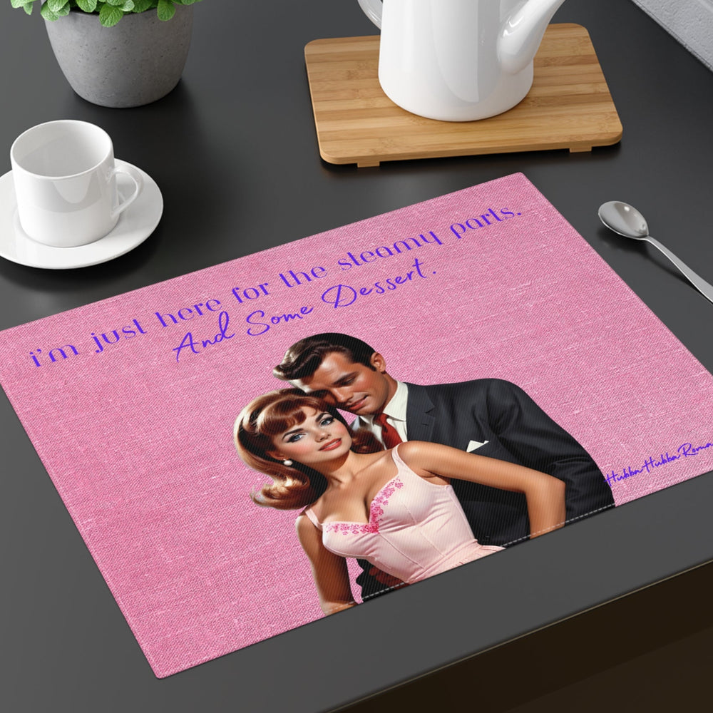 The placemat is displayed on a table with a cup and saucer, a teapot, a plant, and a spoon for context.


