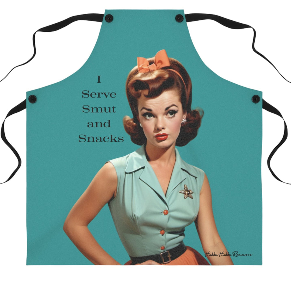 A teal-colored apron with black straps features a vintage-style illustration of a glamorous 1950s woman with red hair styled in curls. She is wearing a mint green blouse with a sheriff’s star brooch, an orange skirt, and a matching bow in her hair. The text beside her reads: "I Serve Smut and Snacks." 