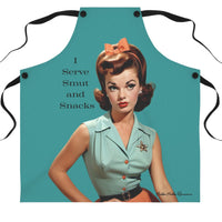 A teal-colored apron with black straps features a vintage-style illustration of a glamorous 1950s woman with red hair styled in curls. She is wearing a mint green blouse with a sheriff’s star brooch, an orange skirt, and a matching bow in her hair. The text beside her reads: "I Serve Smut and Snacks." 