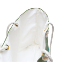 The inside of the tote bag with its creamy colored interior.