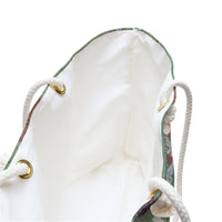 The inside of the tote bag with its creamy colored interior.