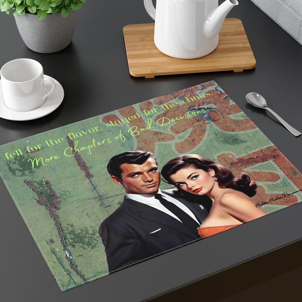 The placemat is displayed on a table with a cup and saucer, a teapot, a plant, and a spoon for context.

