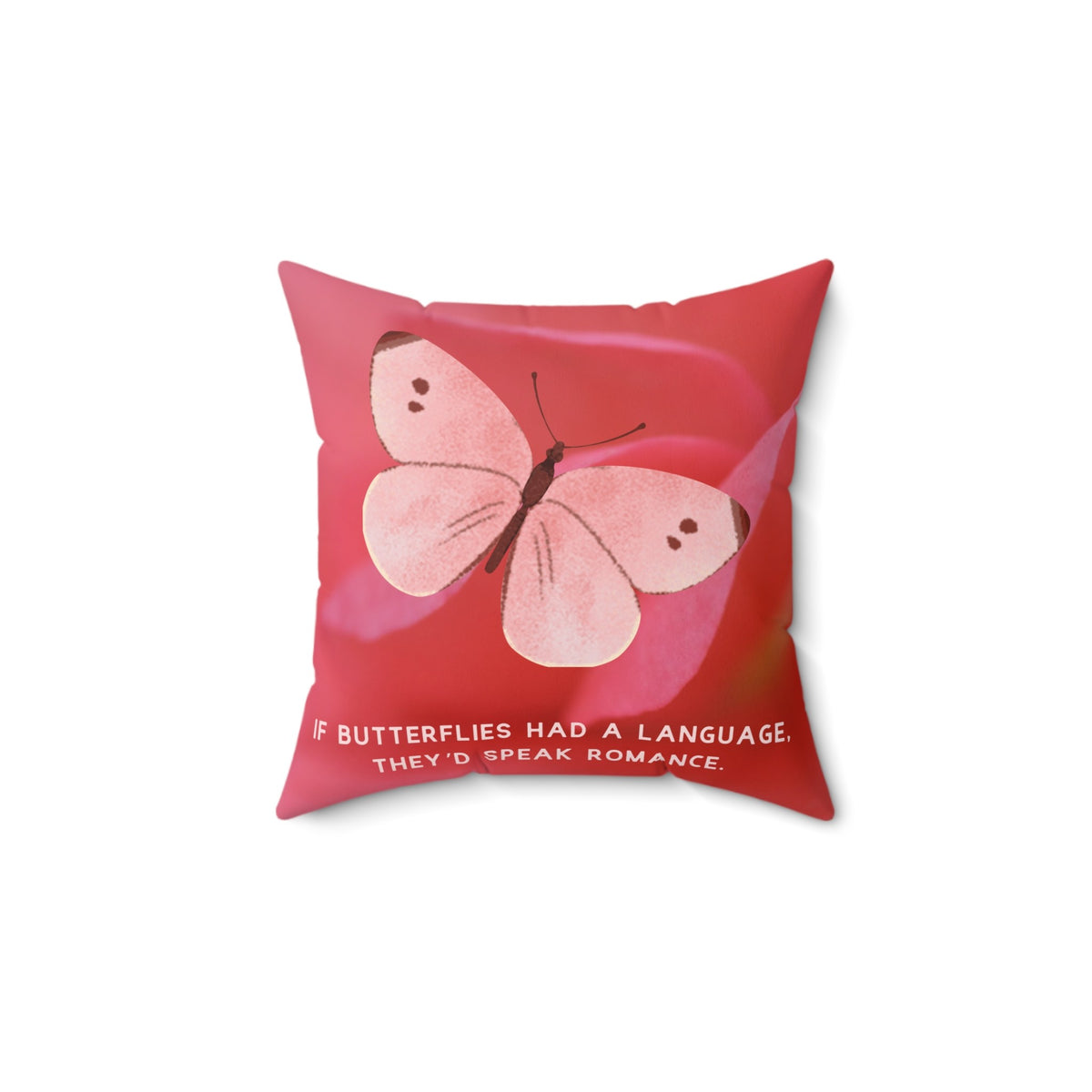 A 14-inch pillow featuring a soft pink butterfly with delicate brown markings on its wings, set against a blurred close-up of a pink flower petal. The butterfly has a watercolor-like texture and a graceful appearance. Below the butterfly, pale pink uppercase text reads: "If butterflies had a language, they’d speak romance." The background is a warm, romantic shade of pink, creating a dreamy and whimsical aesthetic.