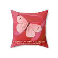 A 18-inch pillow featuring a soft pink butterfly with delicate brown markings on its wings, set against a blurred close-up of a pink flower petal. The butterfly has a watercolor-like texture and a graceful appearance. Below the butterfly, pale pink uppercase text reads: "If butterflies had a language, they’d speak romance." The background is a warm, romantic shade of pink, creating a dreamy and whimsical aesthetic.