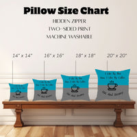 The image shows a "Pillow Size Chart" featuring four square pillows with this image displayed on a wooden bench against a white paneled wall. Pillow sizes range from 14" x 14" to 20" x 20". Also mentioned are a hidden zipper, two-sided print, and machine-washable.