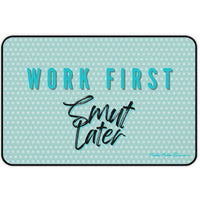 Teal doormat with text 'Work First, Smut Later' on a light blue polka dot background