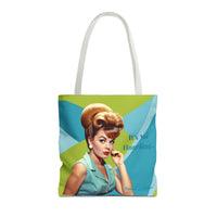Image features a reversible tote bag design with a vibrant mid-century modern background of lime green, light blue, and teal wave shapes. The illustration shows a glamorous retro woman with a voluminous blonde bouffant hairstyle, red lips, and teal sleeveless blouse. One side reads “It’s Not Hoarding…” while the opposite side completes the phrase with “If it’s Romance Books…” The image is playful and snarky, celebrating the relatable chaos of book collecting with vintage flair.