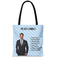 Reverse side of tote bag with light blue striped background, illustrated billionaire book boyfriend, and checklist including: “Great Hair, Sparkling Eyes, Kissable Lips, Chiseled Jaw, Super Tall, Great Body, Designer Wardrobe, Secret Soft Side.” Text reads: “I've Got A Kindle!”