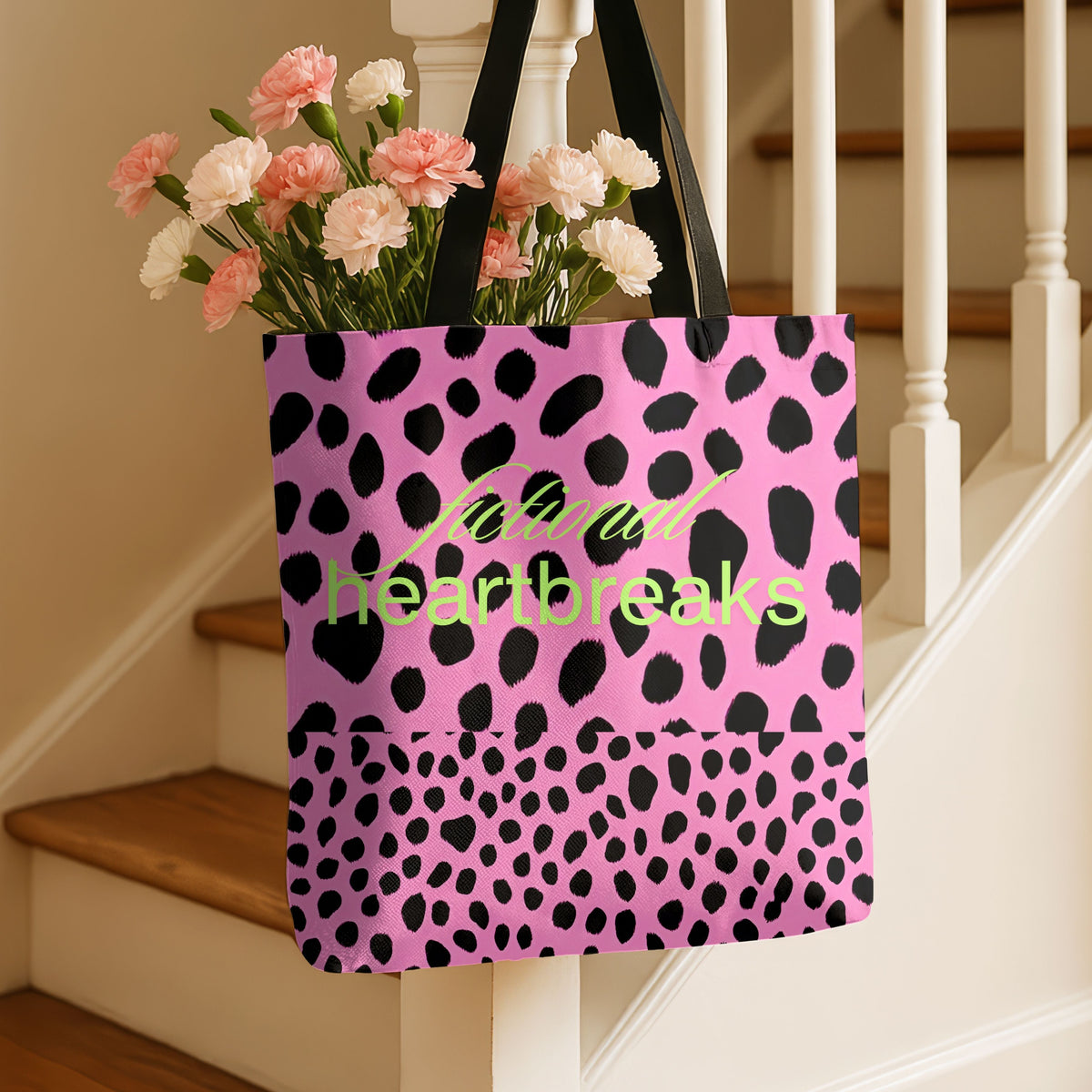 The pink leopard tote bag is displayed by hanging it from a newal post on a stairway.
