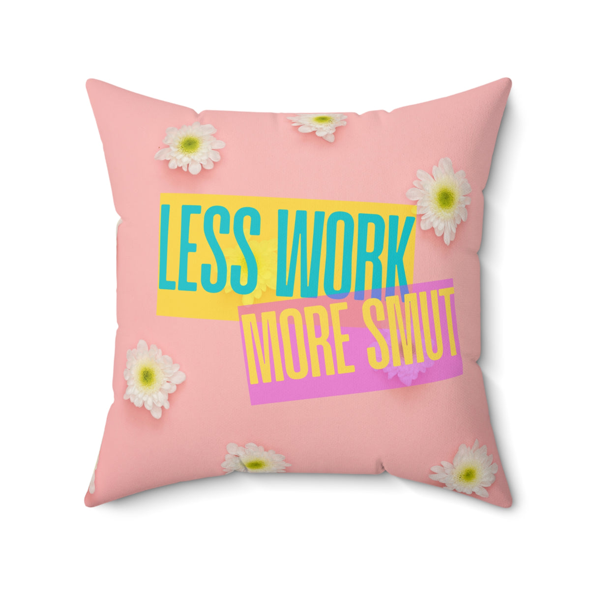 Square pillow with pink background, white daisies, and text: “Less Work. More Smut.”