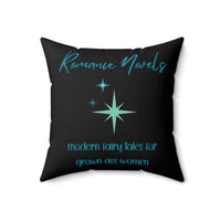Square pillow with black background, teal starbursts, and text: “Romance Novels. Modern fairy tales for grown ass women.”