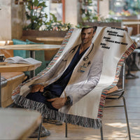 Prescription Strength Romance woven blanket featuring a book boyfriend doctor draped over a reading chair in a cafe