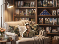 Decorative throw pillow featuring a handsome military book boyfriend with short brown hair, light stubble, and dog tags, wearing a camouflage army shirt. Shown in a cozy reading nook with bookshelves and military romance novels.