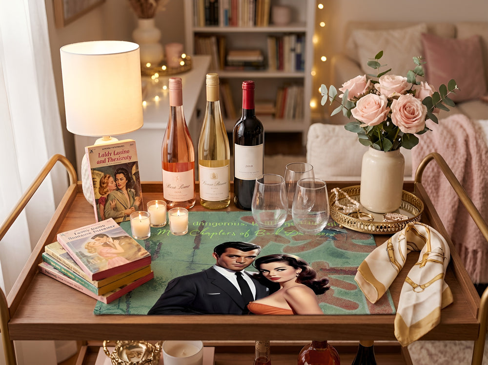 Romance-reader cotton accent mat displayed on a stylish bar cart with wine bottles, vintage romance novels, candles, flowers, and decorative accessories. Bookish home decor featuring retro romance artwork designed for bar carts, reading nooks, and cozy spaces.
