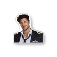 Custom-shaped decorative pillow featuring The Pilot, an aviation romance book boyfriend with dark hair, light stubble, and a confident smile, wearing a commercial pilot uniform with captain’s stripes and loosened tie. Shown as a standalone pillow against a neutral background. This aviation romance book boyfriend pillow is available in three sizes (10" x 10", 16" x 16", and 22" x 22").