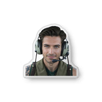 Custom-shaped decorative pillow featuring The Fighter Pilot, a military romance book boyfriend with dark hair, striking eyes, and a confident smile, wearing a flight headset and tactical vest. Shown as a standalone pillow against a neutral background. This military romance book boyfriend pillow is available in three sizes (10" x 10", 16" x 16", and 22" x 22").