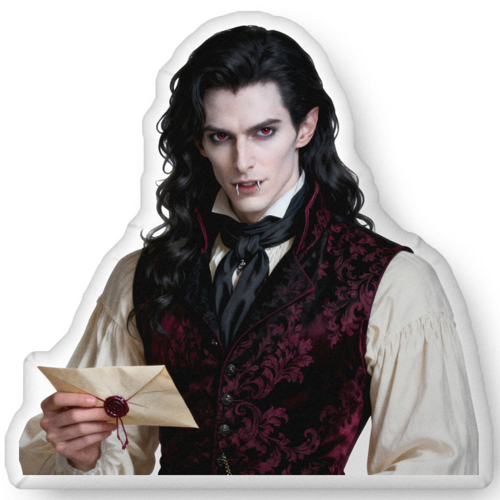 Custom-shaped gothic vampire book boyfriend decorative pillow featuring a pale, dark-haired aristocratic man holding a sealed letter, wearing a burgundy patterned vest and white shirt against a transparent background. Available in three sizes: 10″ × 10″, 16″ × 16″, and 22″ × 22″.